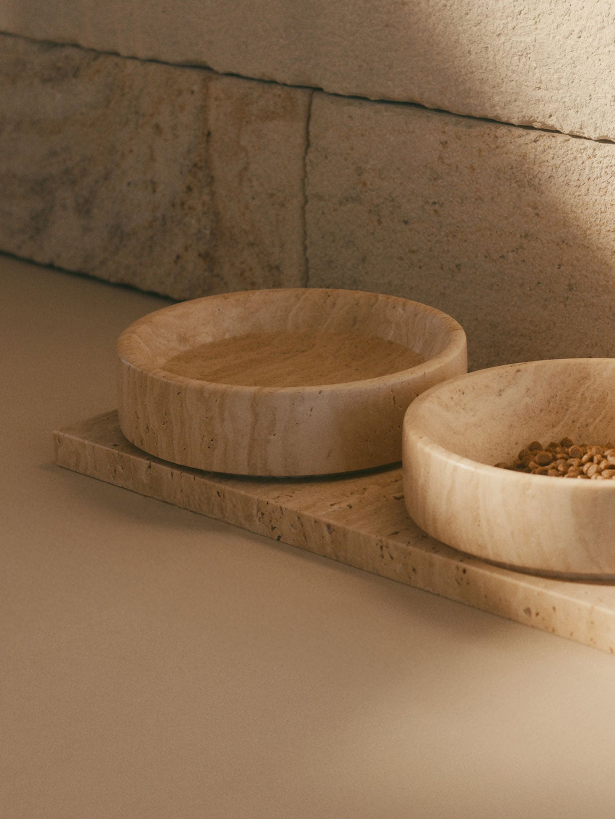 Close-up of food in Mila travertine pet bowl on tray
