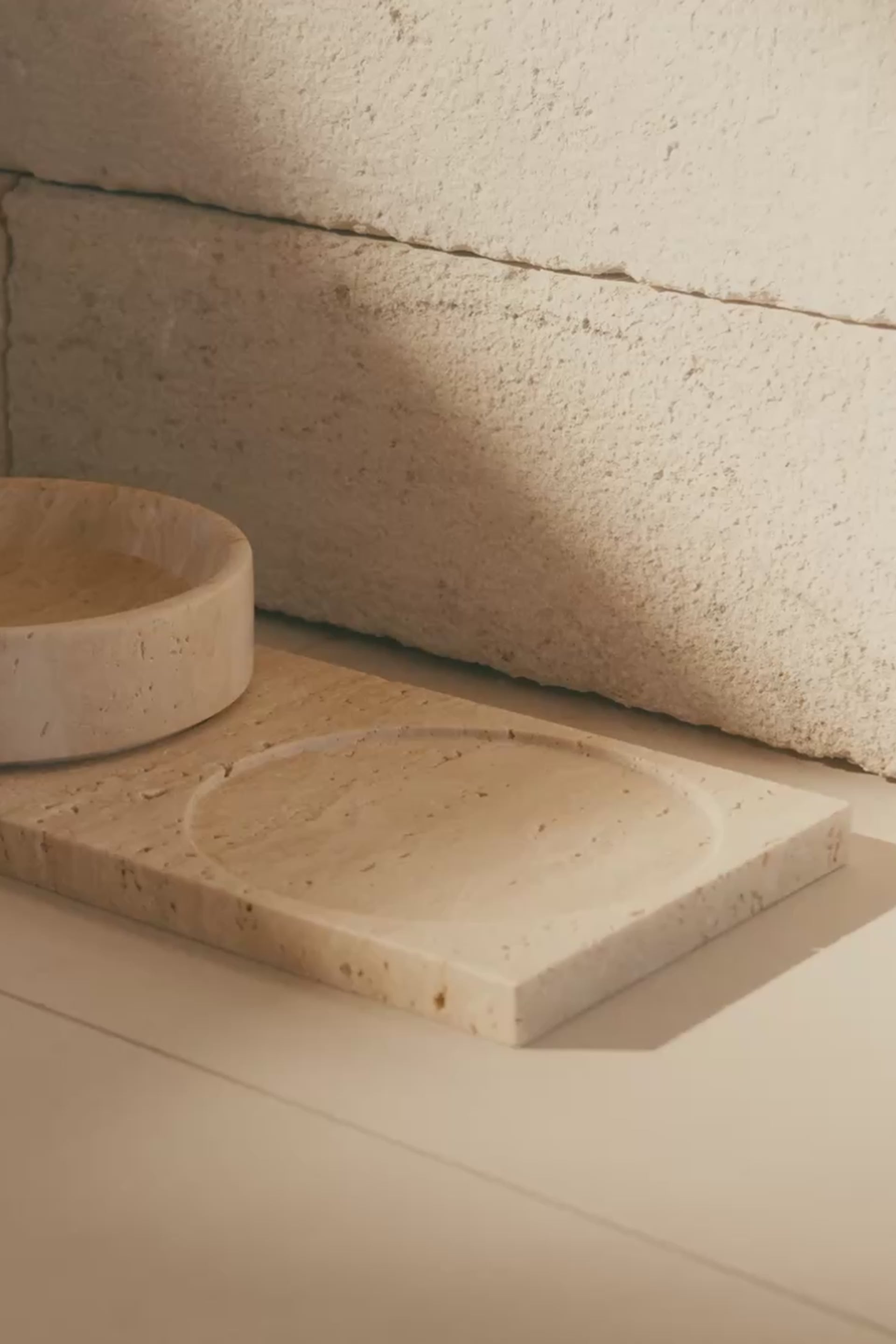 Mila travertine pet bowls being filled with food and water by hand - mobile cropped video